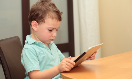 young boy with ipad